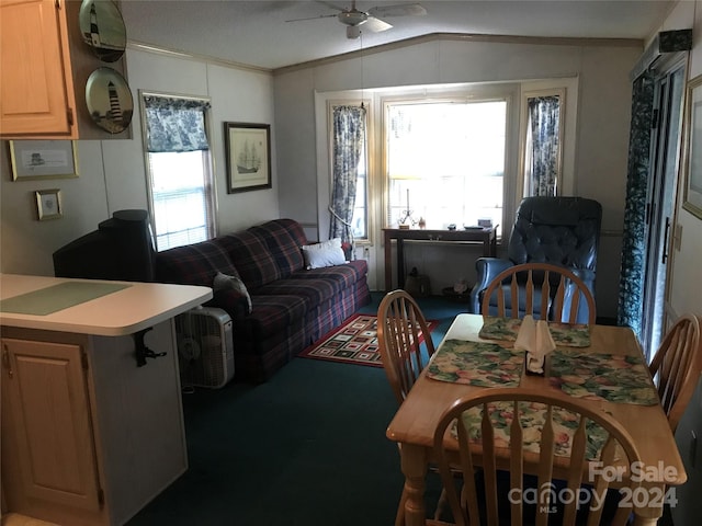 dining room featuring a ceiling fan and lofted ceiling