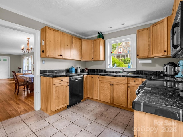 kitchen with a textured ceiling, light hardwood / wood-style floors, a chandelier, black appliances, and sink