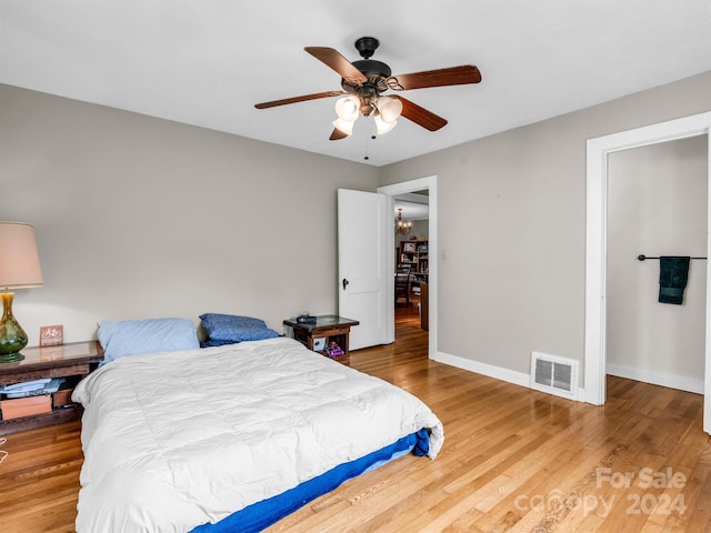 bedroom featuring ceiling fan and light hardwood / wood-style flooring