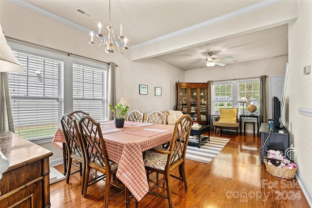 dining room with hardwood / wood-style floors and ceiling fan with notable chandelier