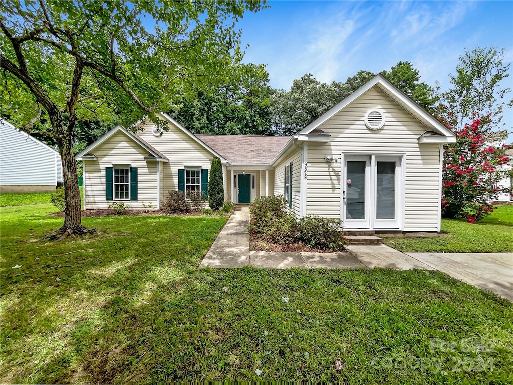 ranch-style house with a front yard