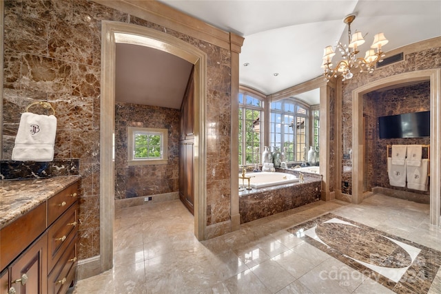 bathroom featuring visible vents, a garden tub, marble finish floor, vanity, and a notable chandelier