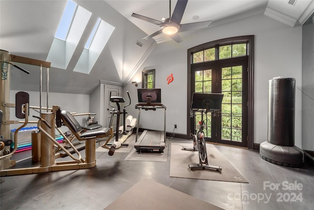 workout room featuring a ceiling fan, visible vents, vaulted ceiling, baseboards, and french doors