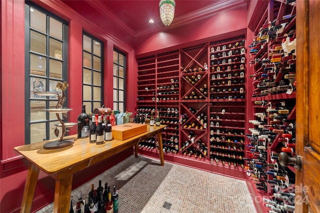 wine cellar featuring ornamental molding and recessed lighting