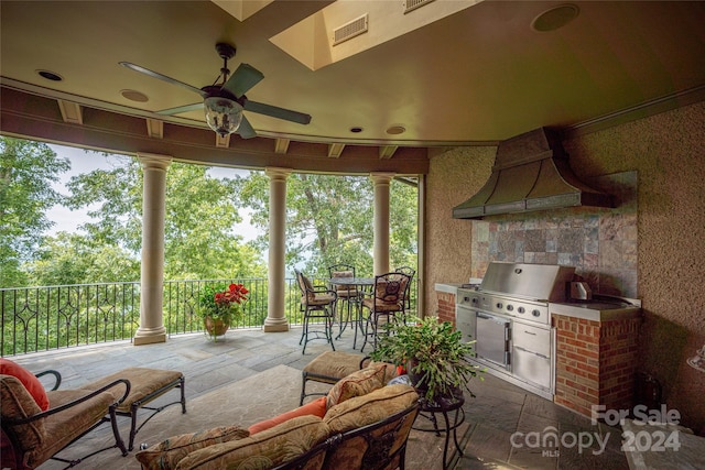 view of patio featuring ceiling fan, area for grilling, fence, visible vents, and a grill