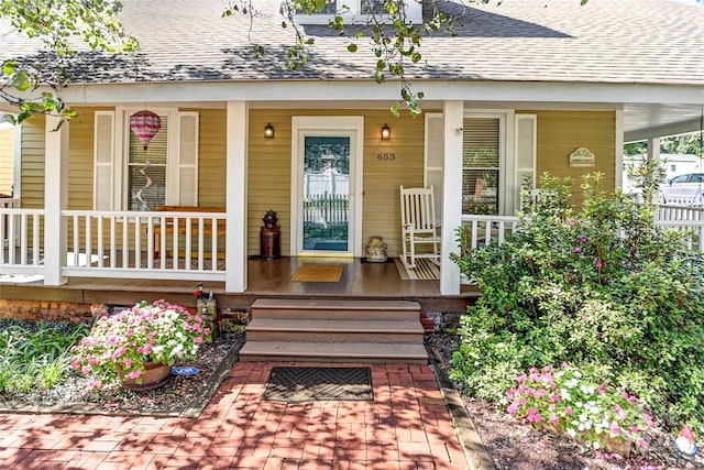 entrance to property featuring a porch