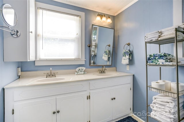 bathroom featuring crown molding and vanity