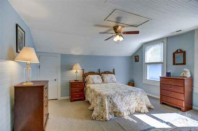 bedroom featuring ceiling fan, lofted ceiling, and light colored carpet