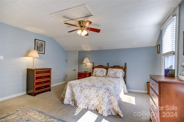 bedroom featuring vaulted ceiling, ceiling fan, and light colored carpet