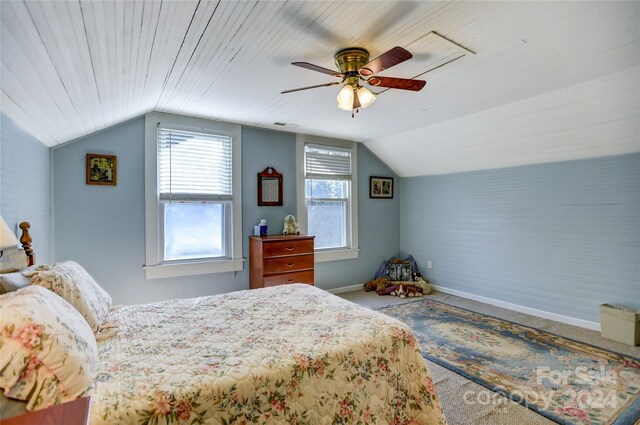 bedroom featuring ceiling fan, carpet, and lofted ceiling