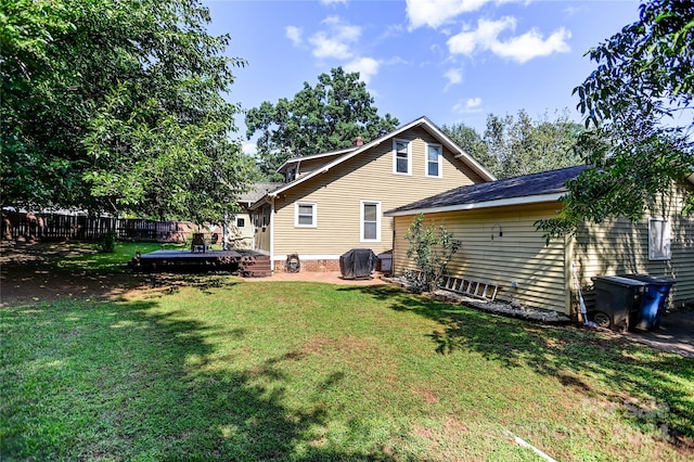 rear view of house with a lawn