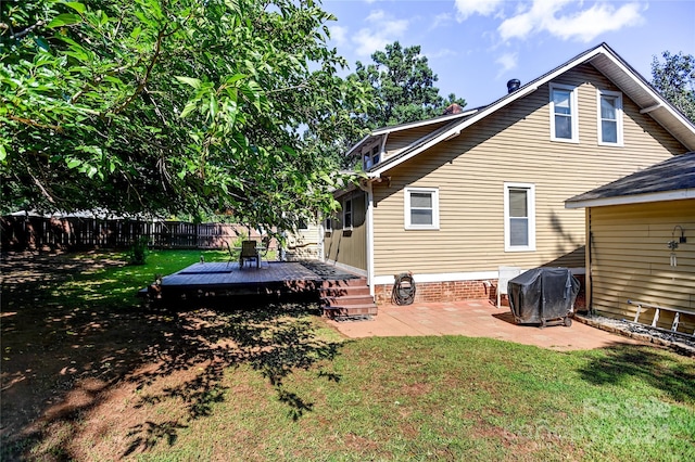 exterior space with a wooden deck and a patio