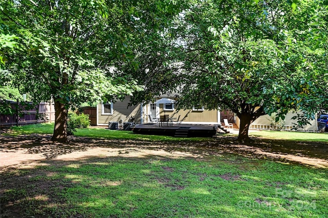 view of yard with a wooden deck