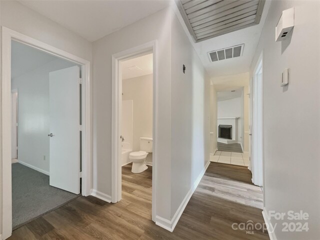 hallway with wood-type flooring