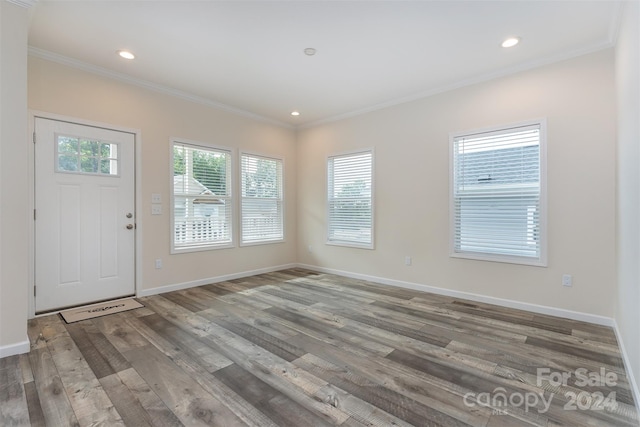 entryway featuring hardwood / wood-style flooring and crown molding