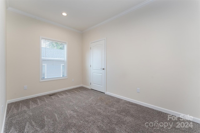 carpeted empty room with ornamental molding