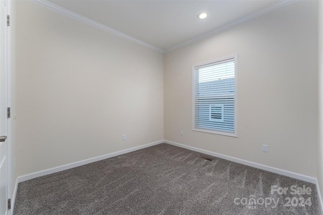 carpeted empty room with ornamental molding