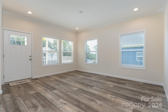 entrance foyer featuring hardwood / wood-style floors and ornamental molding