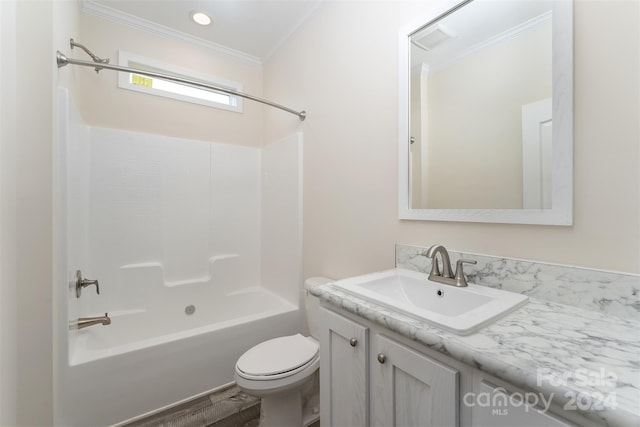 full bathroom featuring toilet, tub / shower combination, ornamental molding, and vanity