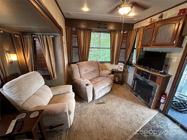 113 Hummingbird Cir, New London, NC 28127 - living room with a ceiling fan, carpet, and a glass covered fireplace