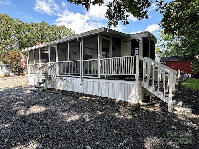 113 Hummingbird Cir, New London, NC 28127 - view of side of property with a sunroom and stairway