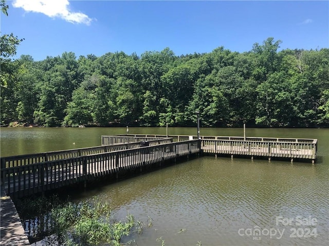 113 Hummingbird Cir, New London, NC 28127 - view of dock featuring a water view and a forest view