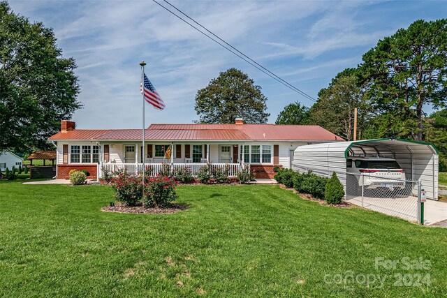 view of front of home featuring covered porch and a front yard