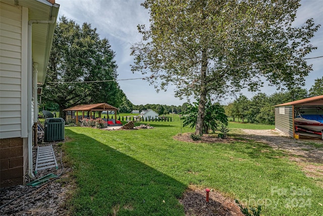 view of yard featuring cooling unit and a gazebo