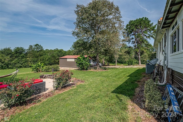 view of yard featuring an outbuilding and a patio