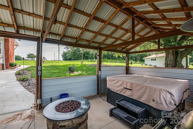 view of patio featuring an outdoor fire pit and a gazebo