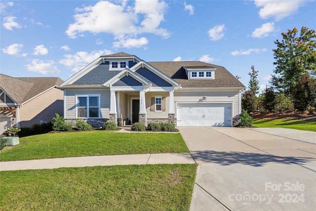 craftsman-style home with central AC unit and a front yard