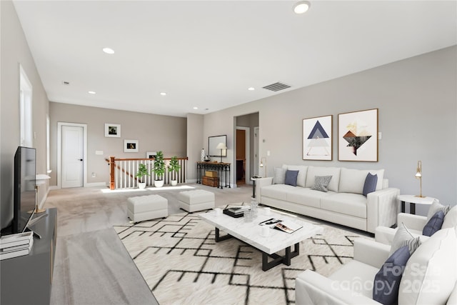 living room with light carpet, baseboards, visible vents, and recessed lighting