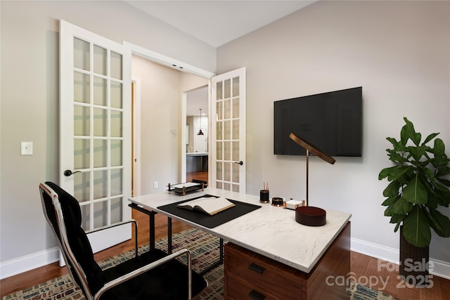 office space with dark wood-style floors, french doors, and baseboards