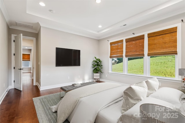 bedroom featuring attic access, baseboards, a raised ceiling, dark wood-style flooring, and recessed lighting