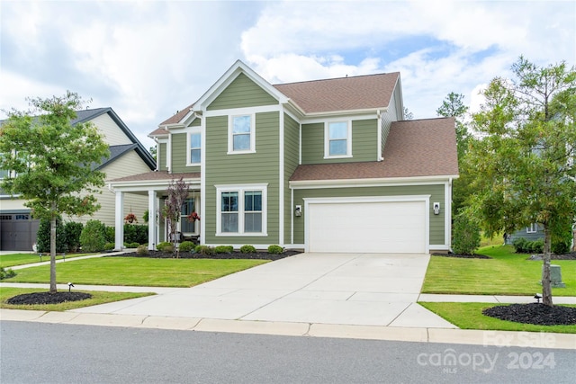 view of front facade featuring a front yard and a garage