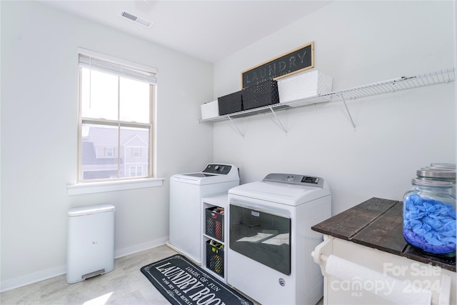 laundry area featuring washing machine and clothes dryer