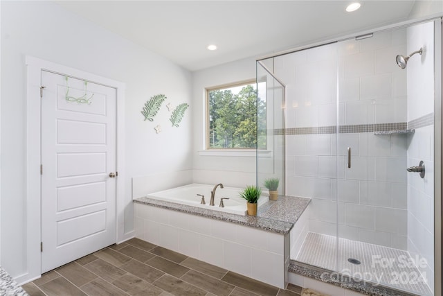 bathroom featuring plus walk in shower