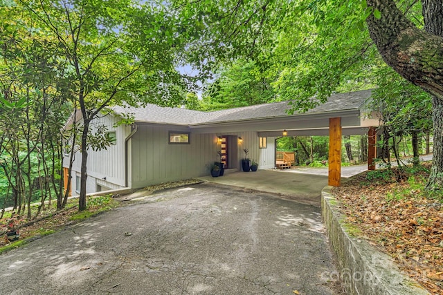 exterior space with a carport