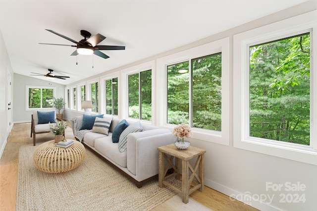 sunroom / solarium with ceiling fan and plenty of natural light