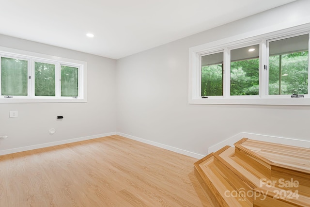 spare room featuring light wood-type flooring