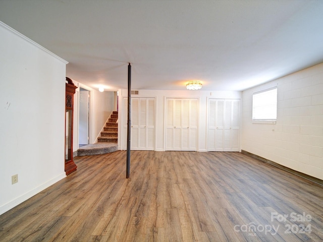 basement featuring hardwood / wood-style floors