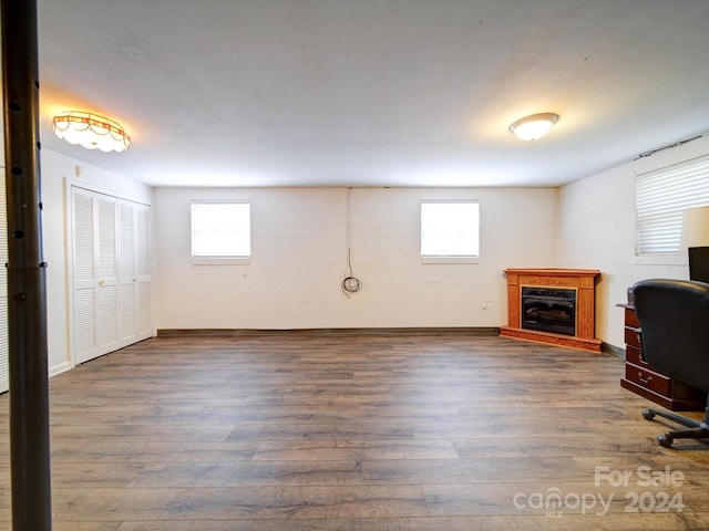 unfurnished office featuring plenty of natural light and hardwood / wood-style floors