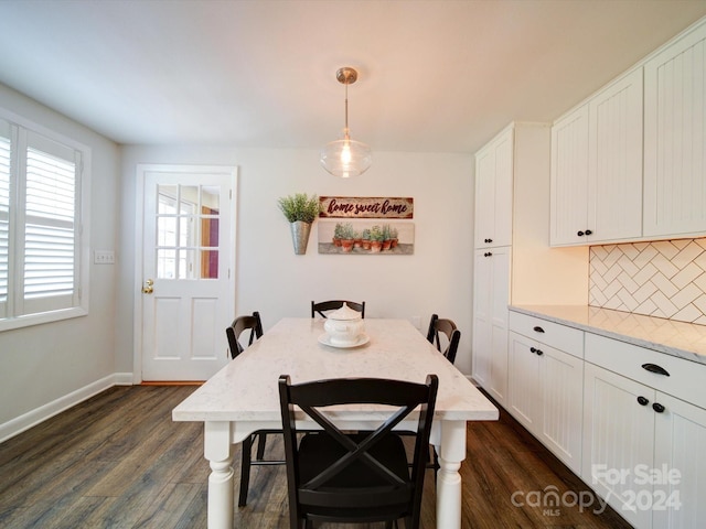 dining area with dark hardwood / wood-style flooring