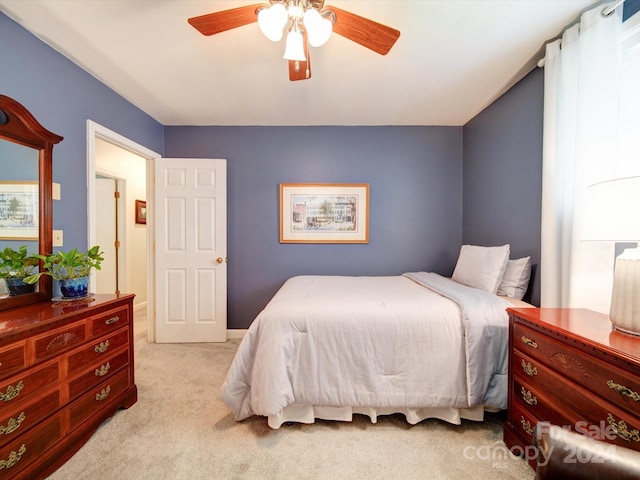 bedroom featuring ceiling fan and light colored carpet