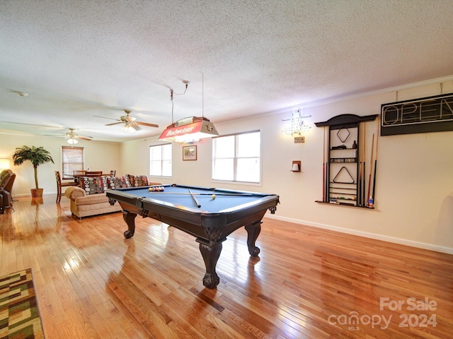 game room with billiards, hardwood / wood-style flooring, ceiling fan, and a textured ceiling