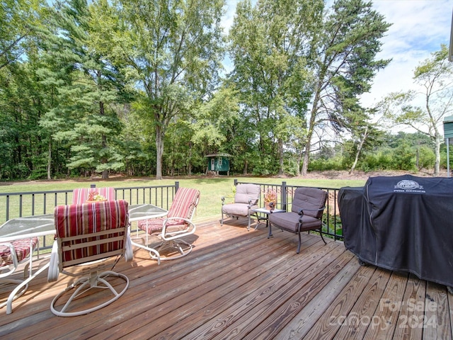 deck with a yard and a grill