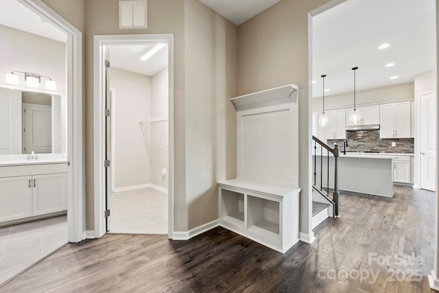 mudroom featuring hardwood / wood-style floors and sink