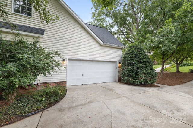 view of property exterior featuring a garage