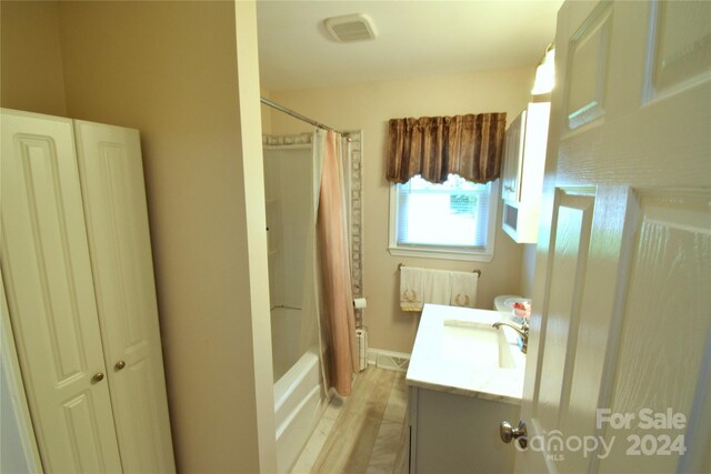 bathroom featuring tile patterned floors, vanity, and shower / tub combo