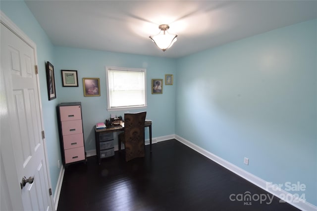 home office with baseboards and dark wood-style flooring